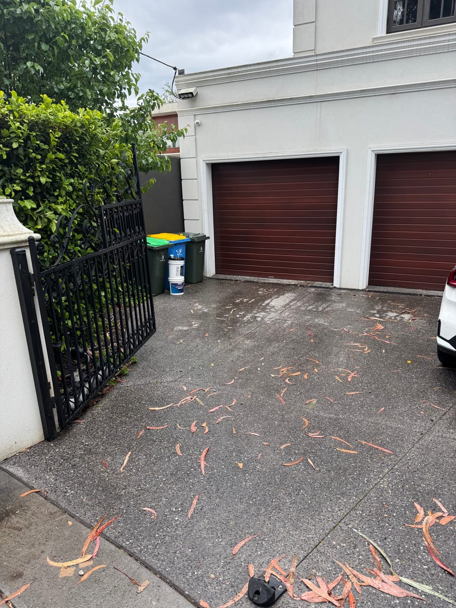Clean driveway in front of garages after rubbish removal in Melbourne