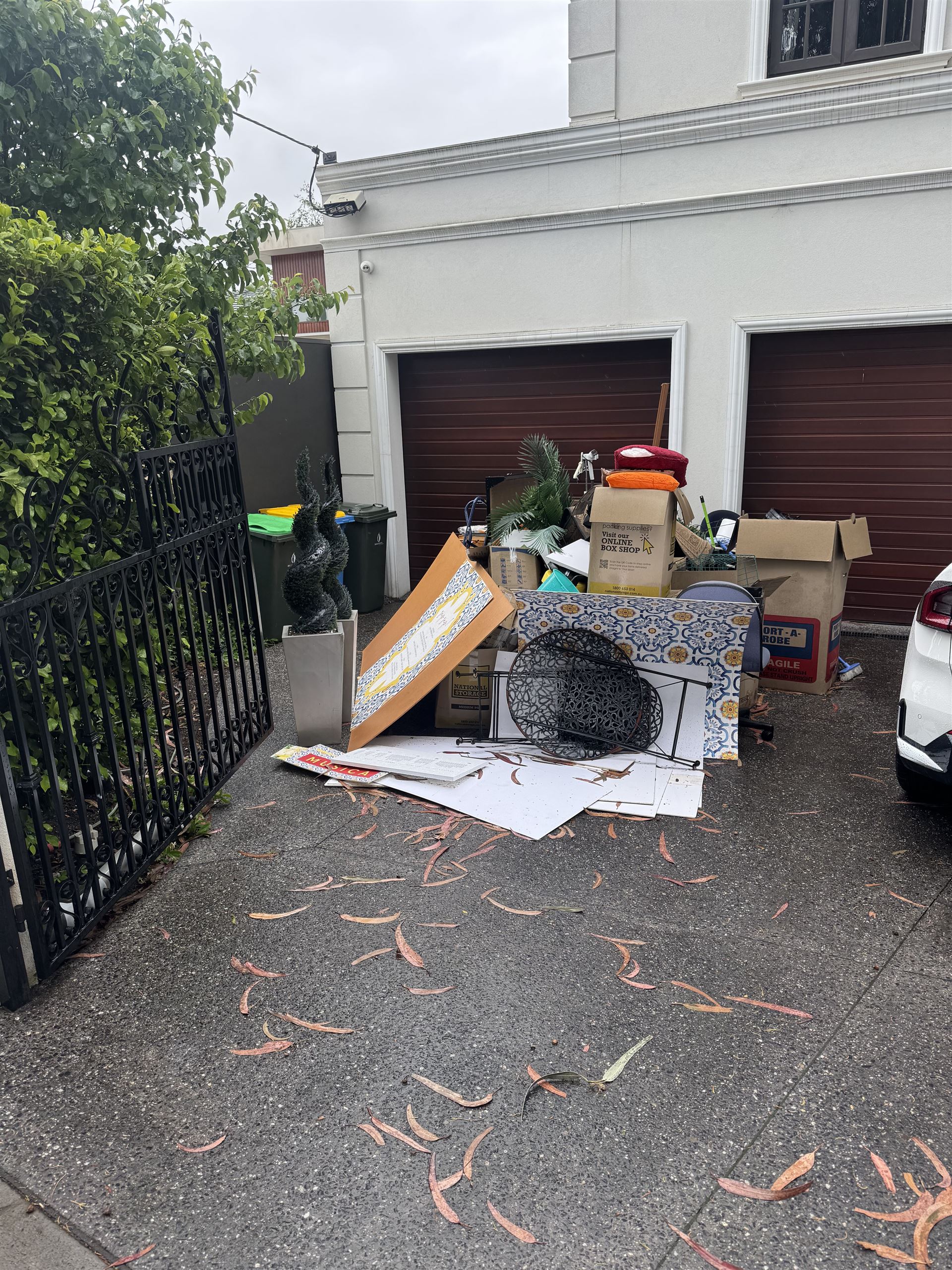 Driveway piled with household items