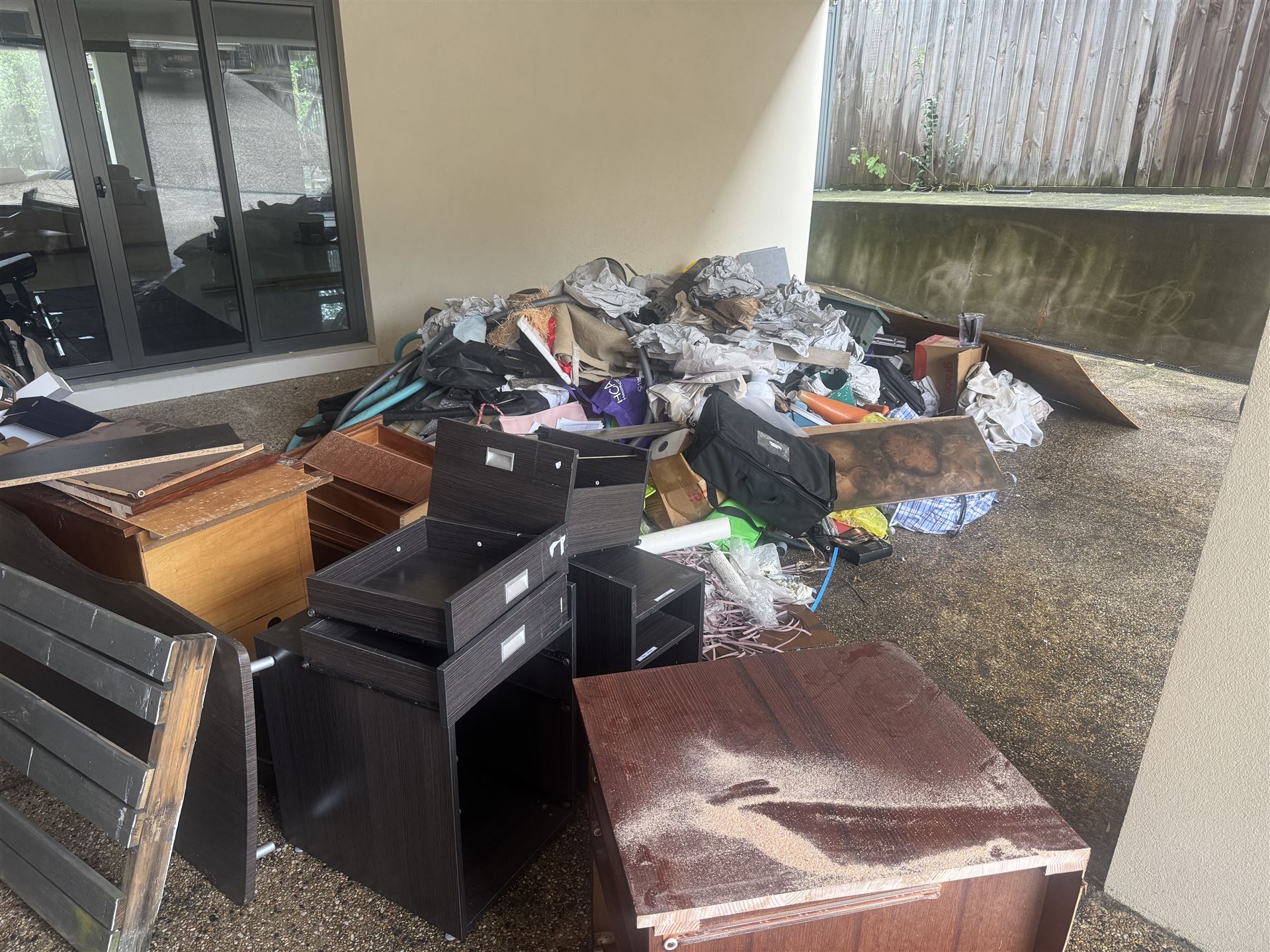 Covered patio piled with renovation junk